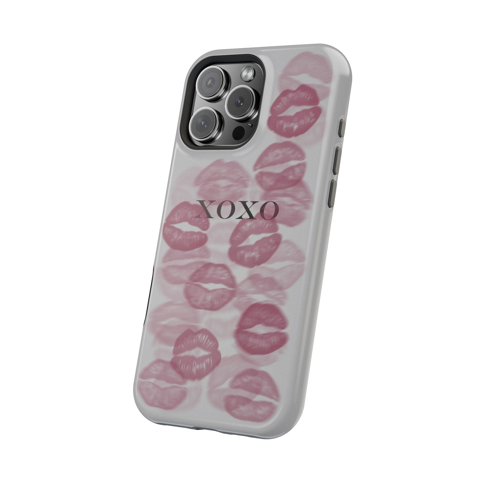 phone case with grey background, pink lipstick kiss marks dotted all around and black XOXO text in the middle, magsafe angeled